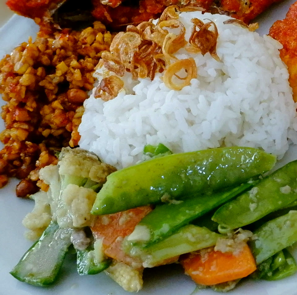 Nasi campur with orek tempeh and vegetables