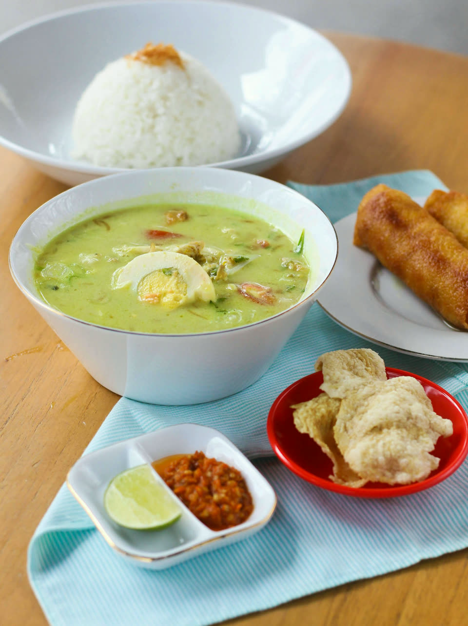 Free-range chicken soto with rice, perkedel, crackers and sambal